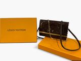 louis vuitton black and gold clutch bag