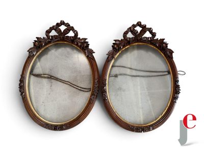 pair of antique oval mirrors with carved wood frame and glass inserts