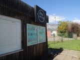 a small building with a sign on the side of it