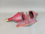 a broken pair of shoes that have been left on the floor