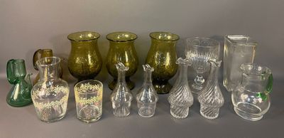 many different glass vases sitting on a table
