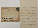 an old envelope with a handwritten letter on it next to a piece of paper