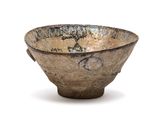 a small bowl that is sitting on a white surface