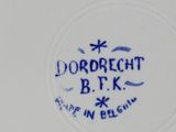 a close up of a plate with a blue and white design on it