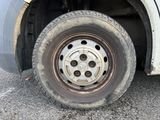 a flat tire on the side of a truck