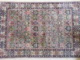 an antique persian rug on display in a museum
