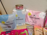 many different types of dog food and treats on the table