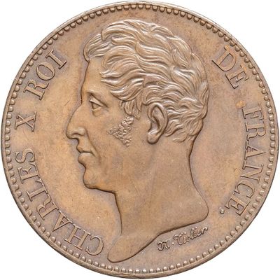 gros plan d'une pièce de monnaie sur laquelle figure un visage de femme