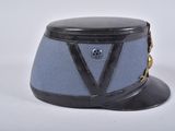 a blue hat with black trim and a black hat with a v on it