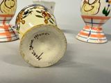 three vases that have been painted with flowers on them