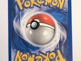 a close up of a card with a pokemon ball on it