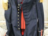a suit case that has a military uniform inside of it