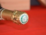 a bottle of wine with a gold foil wrapper on it