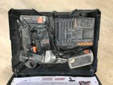a black and decker tool in a case on the floor