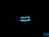an image of a close up of a toothbrush in the dark