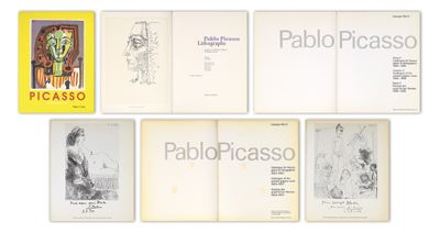 plusieurs livres sont alignés sur une surface blanche
