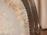 a close up of the back of a chair with lace on it