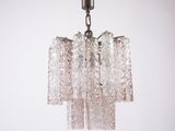 a glass chandelier hanging from the ceiling