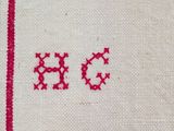 an image of a close up of a piece of cloth with red stitching