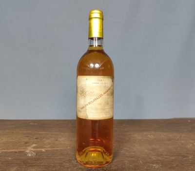 a bottle of wine that is sitting on a table