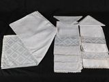 four pieces of white handkerchiefs on a black background