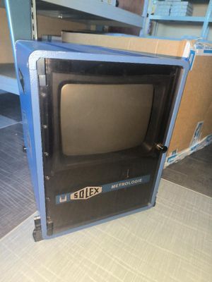a small television sitting on top of a shelf in a room