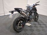 a motorcycle that is parked on the floor in a room