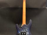 a blue electric guitar sitting on top of a wooden stand