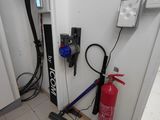 an image of a fire extinguisher in the corner of a room