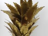 brass pineapple candle holder with a white background