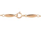 a gold plated bracelet with an oval clasp