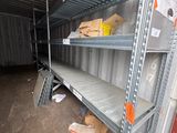 shelves in a storage area with boxes and boxes on them