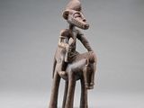 an image of a statue of a man sitting on top of a horse