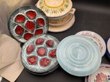 many plates and bowls that are on the table