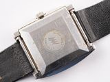an image of a close up of a wrist watch on a white surface