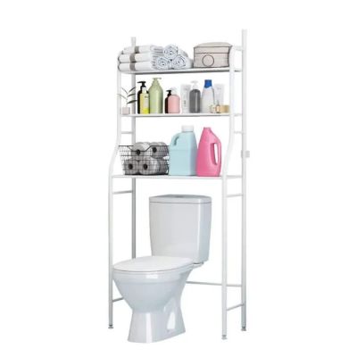 a white toilet with a shelf above it next to a toilet