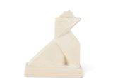 a white sculpture of a cat sitting on a white surface
