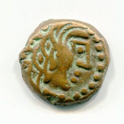 une vieille pièce de monnaie sur laquelle figure un lion, sur un fond blanc