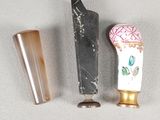 three different types of toothbrushes on a white surface