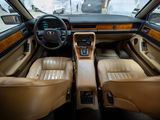 the interior of a car with leather seats and a steering wheel