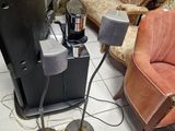 a television that is sitting on a stand next to a couch
