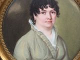 portrait of a woman in a green dress in a gold frame