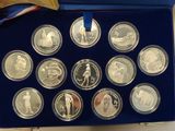 an image of a blue box containing a collection of silver coins