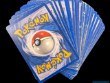 a lot of pokemon cards sitting on top of each other