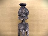 statue of a man with a hat on his head