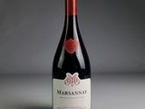 a bottle of wine that is sitting on a table