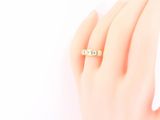 an image of a woman ' s hand with a ring on it ' s finger