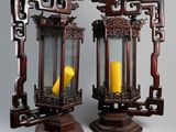 two wooden lanterns with a yellow candle inside of them