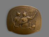 an image of a bronze medal with a woman and a man