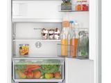an open refrigerator with a lot of food inside of it